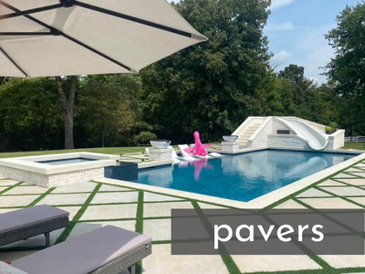 pool surrounded by stone pavers